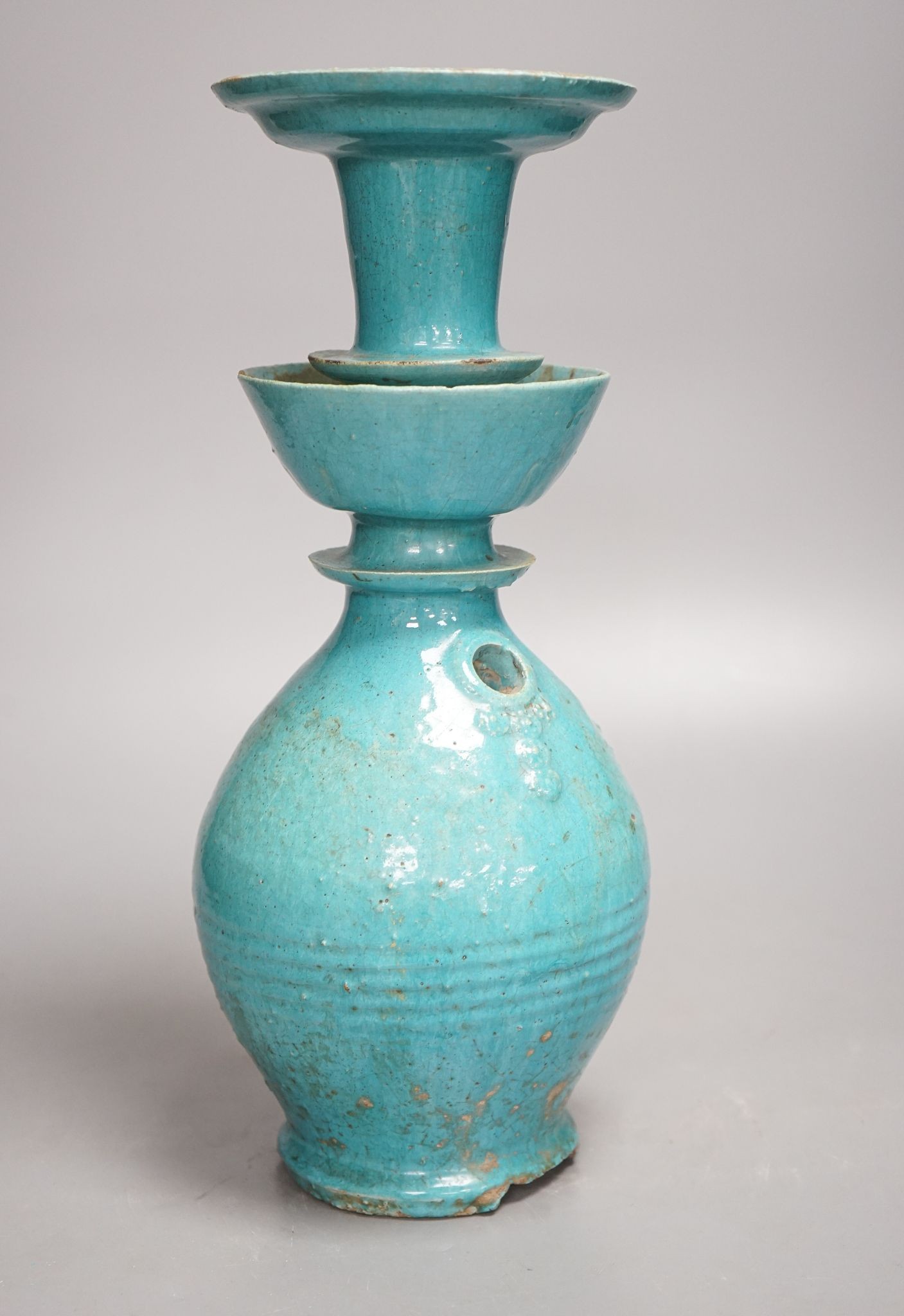 A Persian turquoise glazed huqqa base, 17th century or later, 33cm